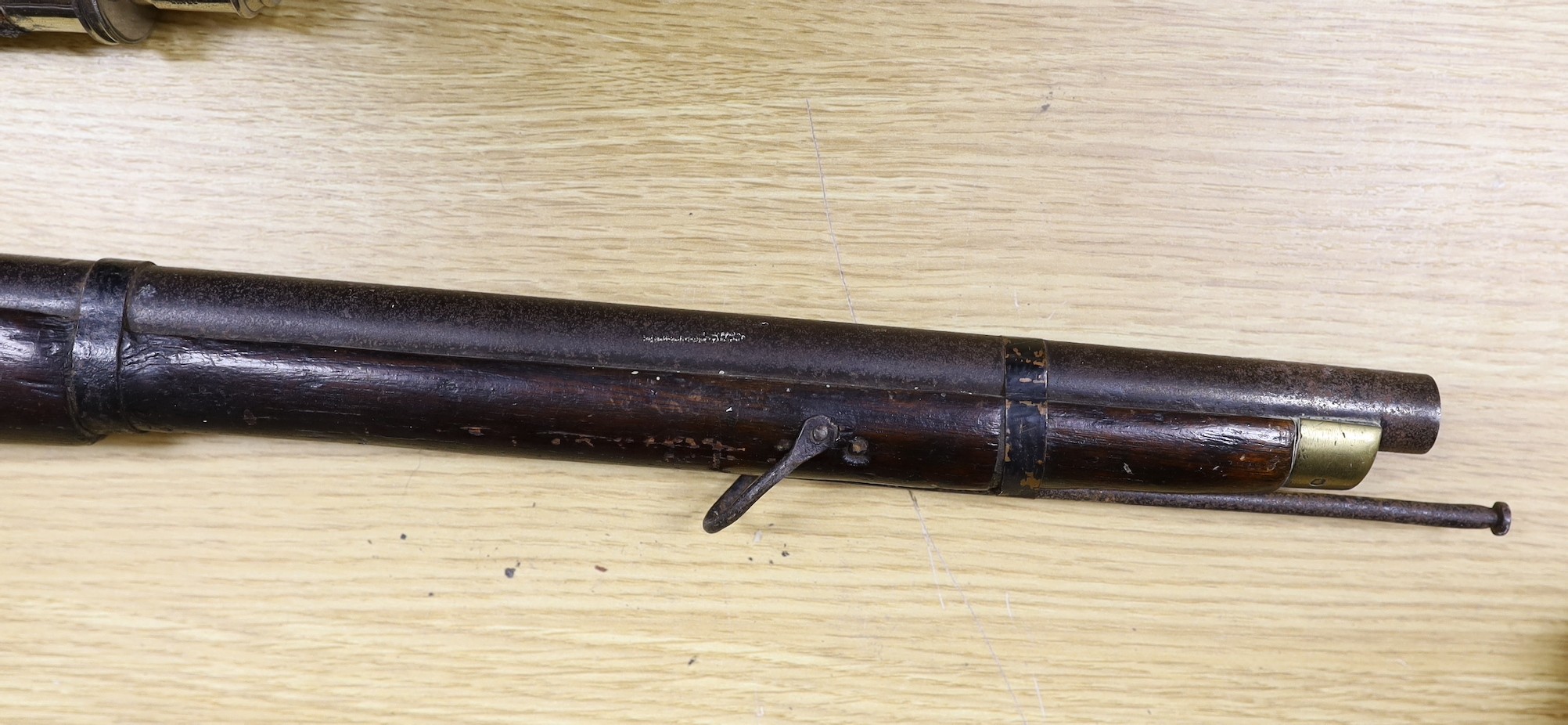A 19th century percussion cap carbine musket with name stamped to lock plate and a shot flask, musket 94cms long